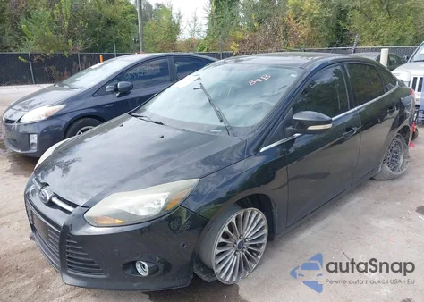 2013 Ford Focus Titanium z USA, uszkodzony, nr VIN 1FADP3J23DL169468